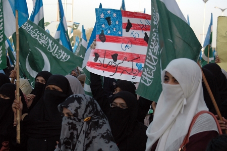 KARACHI/PAKISTAN_ Pakistanis in thousands staged protes rally by Jamaat-e-Islami female and males showed anger toward anti Prophet film and prayed, People  show anger toard film maker and USA ,today on 3 October 2012       のeditorial素材