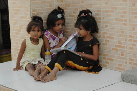 KARACHI/PAKISTAN_ Chistian girl doing their schoo home work in Azam Basti in christian slums area today 25 Oct. 2012        のeditorial素材