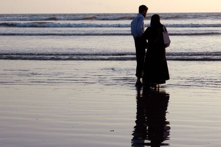 KARACHI/PAKISTAN_ Couppoe walking on seaview beach 1 Dec. 2012        のeditorial素材