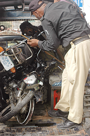 Karachi /Pakistan- Police inspects  Bomb blast in Karachi busy area sadar  preddy street ourside the mosque 2 dead and 3 injuurd today  on        04 July 2014  のeditorial素材