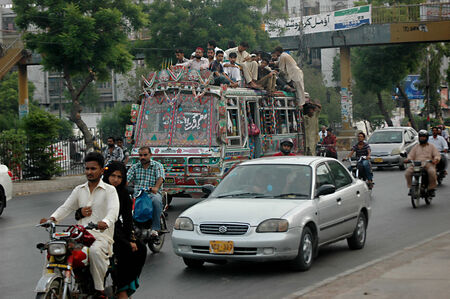 Karachi /Pakistan- Pakistani spend most of time during transport to work and from work to home there is bus shortage in Pakistan there is no bubic bus system and most fo the time people have to find place on busroofs which is dangerous and people of Pakisのeditorial素材