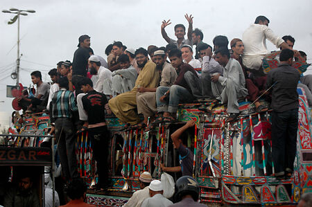 Karachi /Pakistan- Pakistani spend most of time during transport to work and from work to home there is bus shortage in Pakistan there is no bubic bus system and most fo the time people have to find place on busroofs which is dangerous and people of Pakisのeditorial素材