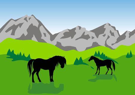 mountainous landscape with green fields and horsesの写真素材