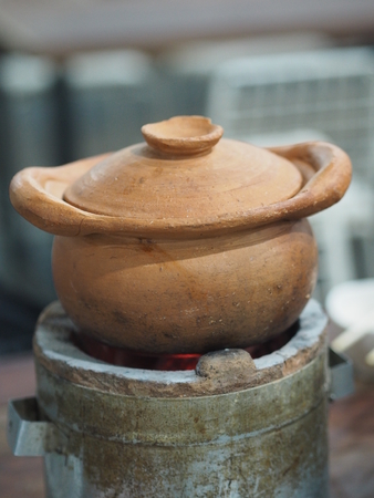 Hot pot Clay pot on charcoal stove Cooking foodの写真素材