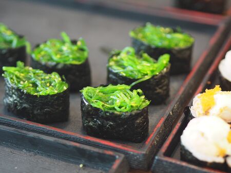Sushi Japanese food Rice ball on top with Seaweed Saladの写真素材