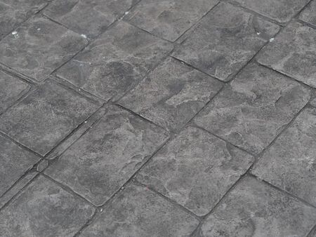 Stamp concrete black color hardener printing patterns on the cement or mortar surface Square pattern...