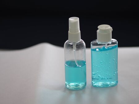alcoholic 70 percent in clear Plastic bottle Spray, and Hand Sanitizer gel on white table washing...