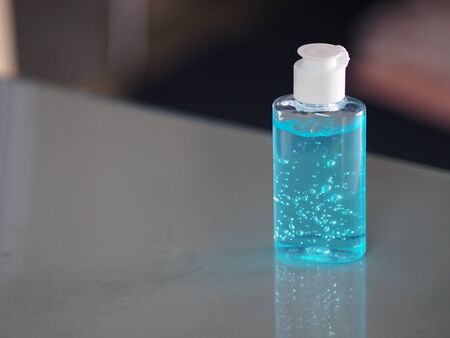Hand Sanitizer, gel alcoholic mixture with gelatin in clear Plastic bottle with pump pushing wash...