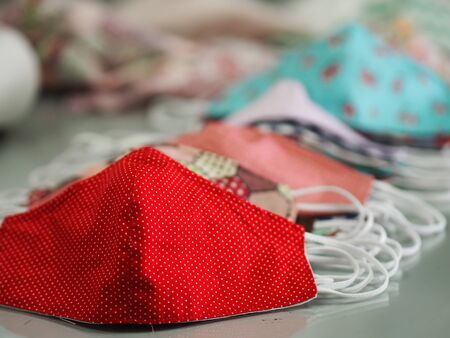 group colorful mask self prevention ill on desk made of fabric for protect dust and germs pm 2.5, coronavirus covid-19の写真素材