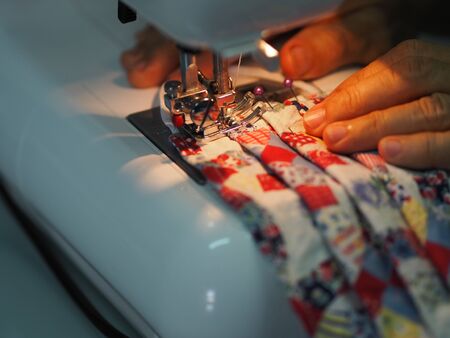 Woman use sew machine to sewing face medical mask protective against during the dust PM 2.5,...