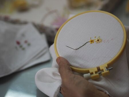 Stitches in hand woman Embroidery Flowers Handmade Art with Simple Stitches