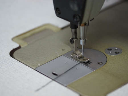 Closeup sewing machine accessories equipmentの写真素材