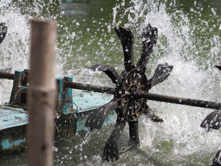 Antique water pump for agriculture, pin wheel, windmillの写真素材
