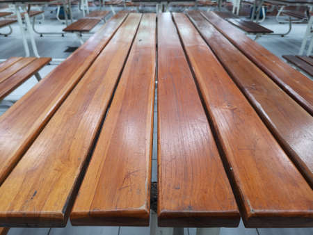 chairs in the cafeteria are empty of people