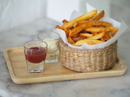 French fries, Potato chips Yellow crispy fries in wooden basket, food snack delicious