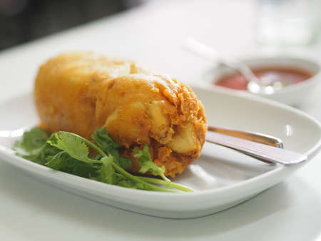 Thai style crab omelet, egg yellow food on white plate