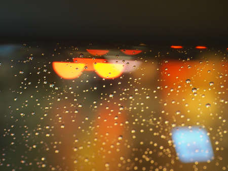Rain drops Bokeh background Abstract light red white and yellow color bokeh beautiful blurred, Design for paper art web mobile applications covers card infographic banners social media and copy writeの写真素材
