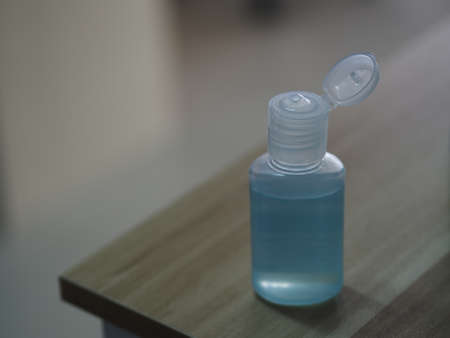 Hand Sanitizer, gel alcoholic mixture with gelatin in clear Plastic bottle with pump pushing wash...