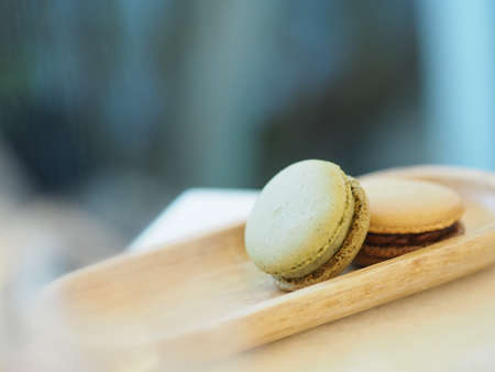 Macaron cofree and green tea, in wooden tray, Dessert snacksの写真素材