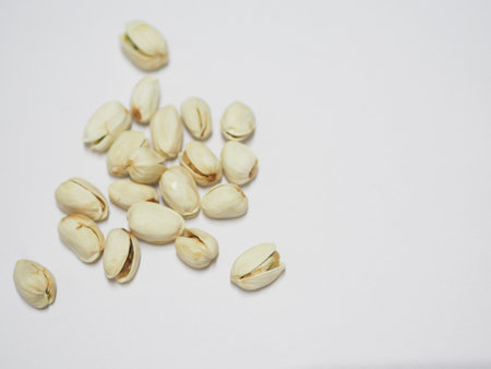 Pistachio dried bean on white background, top view