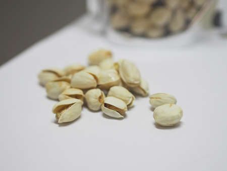 Pistachio dried bean on white background, top view