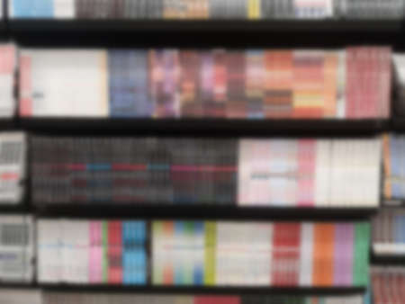 Blurred of Books arranged on shelves, bookshelf in the shop or library, backgroundの写真素材