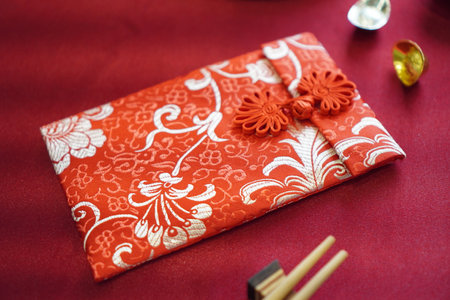 Chinese new year gift box on red background, close-up.