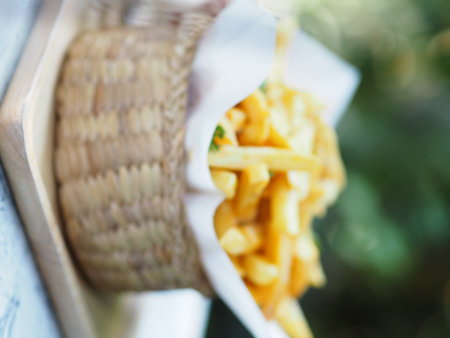 French fries, Potato chips Yellow crispy fries in wooden basket, snack deliciousの写真素材