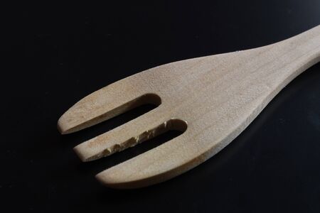 wood fork on black backgroundの写真素材