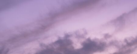 Great sky with sunset clouds all possible shades of pink and purple, big nature background.の写真素材