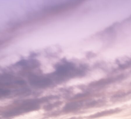 Great sky with sunset clouds all possible shades of pink and purple, big nature background.の写真素材