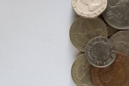 Different coins of different value on white backgroundの写真素材