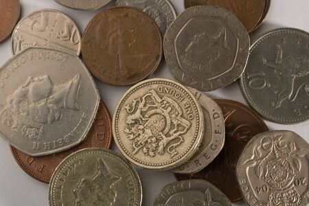 Different coins of different value on white backgroundの写真素材