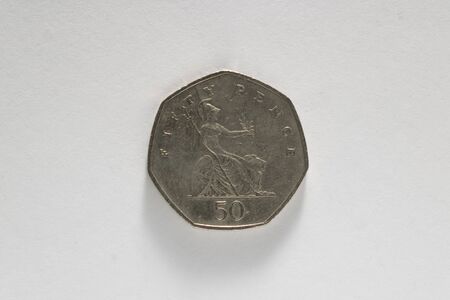 50 pences coin on white background (U.K. currency)の写真素材