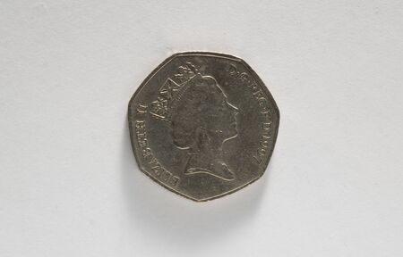Close up of a british 50p coin isolated on white.の写真素材