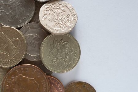 Different coins of different value on white backgroundの写真素材