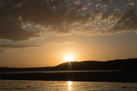 Swamp of Negratin in the province of Granada (Spain) at golden hour with cloudsの写真素材