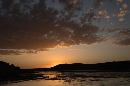 Swamp of Negratin in the province of Granada (Spain) at golden hour with cloudsの写真素材