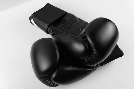 Close-Up Of black Boxing Gloves Against White Background. sports product photographyの写真素材