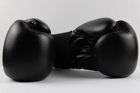 Close-Up Of Red Boxing Gloves Against White Background. sports product photographyの写真素材
