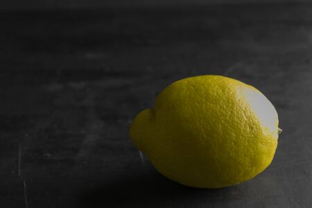Lemon tree on a dark background with space for copying on the sidesの写真素材