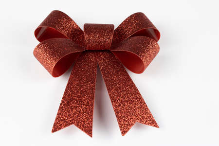 red glitter bow on white background. christmas objectの写真素材