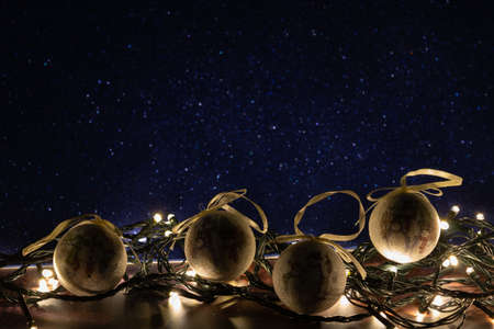 christmas ball on led lights with wooden background. low key imageの写真素材