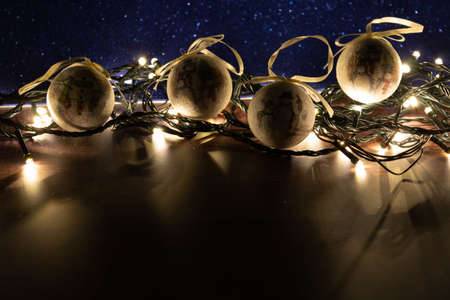 christmas ball on led lights with wooden background. low key imageの写真素材