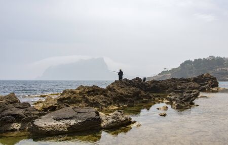 Fisherman fishing in the sea of Pe?iscolaの写真素材