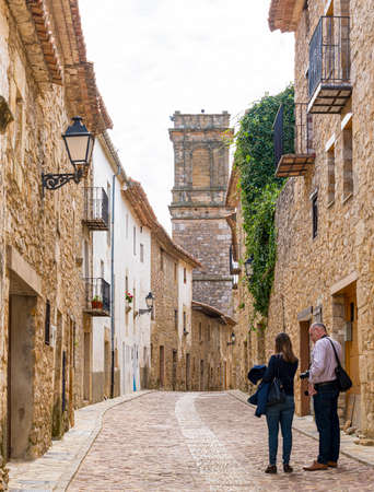 Tourists in a street in the town of Culla (Castellon-Spain)の写真素材