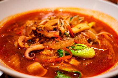 Jjamppong is a Korean noodle soup with red, spicy seafoodの写真素材