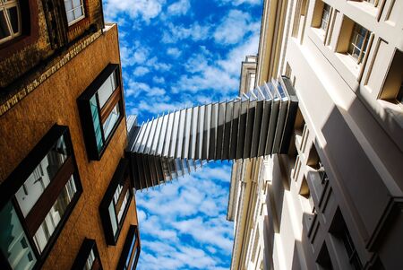 Modern skywalk of rooftop of the building with clear skyの写真素材