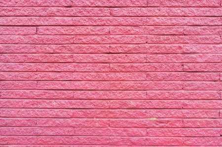 empty brick wall painted in pink