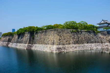 great wall with river of famous historic building, osaka catle, japanの写真素材